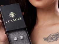 Lady showing Snow design pure silver earring box for girls Lady showing Snow design pure silver earring box for girls