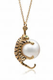 Gold tiger pendant with a pearl silver necklace