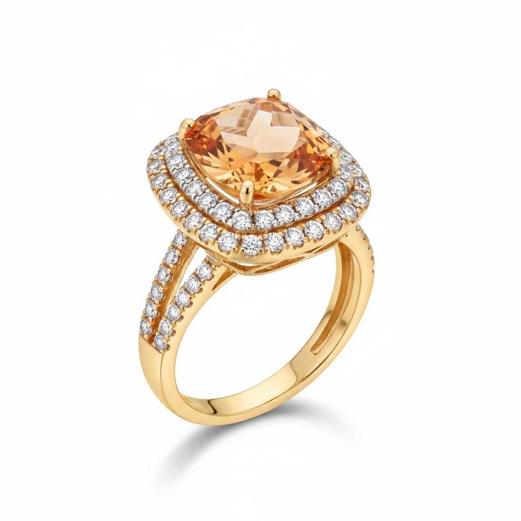sterling silver Gold ring with a large orange gemstone and smaller diamonds on a white background