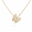 Gold butterfly necklace with diamond accents on a white background